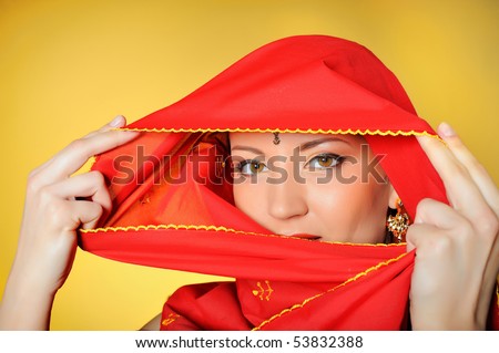 stock photo : Young beautiful woman eyes in indian traditional jewelery, 