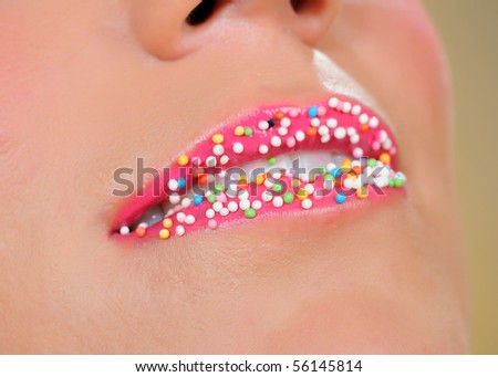 beautiful lips with lots of sweet round candy balls . creative makeup