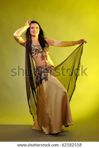 Beautiful sexy dancer woman in bellydance costume with pretty professional stage make-up