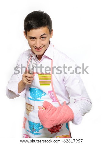 Young happy cook man in apron smiling, holding tool for baking. isolated on white background