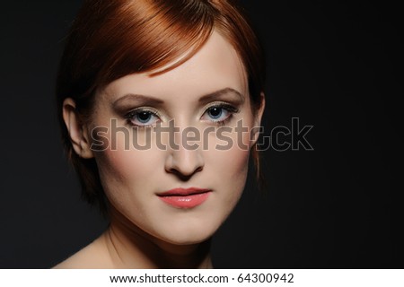 Portrait of pretty woman with pure healthy skin and natural make-up in brown tones looking down