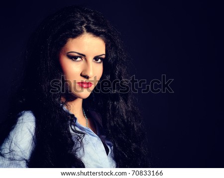 Beautiful model woman with long black healthy hair and bright evening make-up