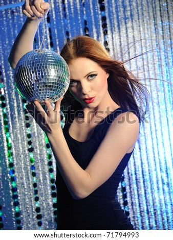 Attractive sexy woman dancing in the disco