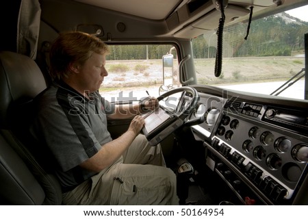 Truck Driver updates his logbook