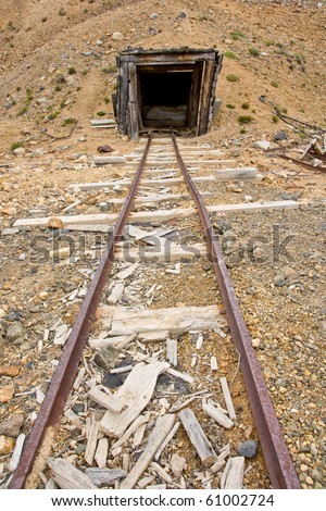 An abandoned mine shaft and rail