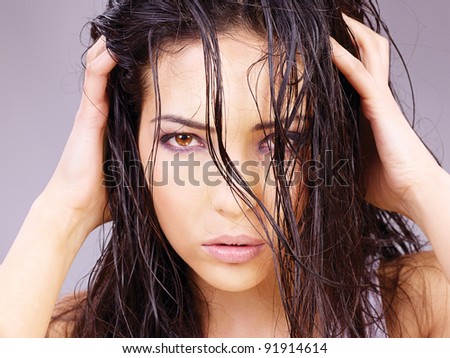 Portrait of a pretty woman with wet hair