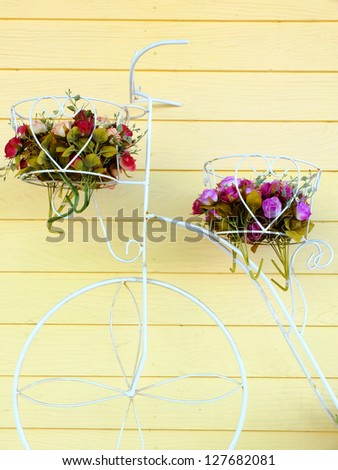 bike with basket of flowers.