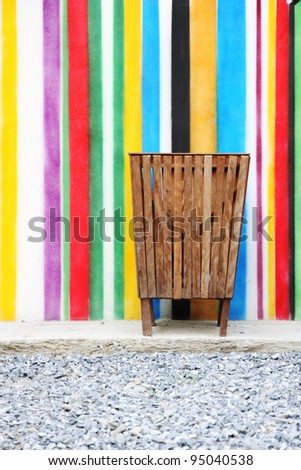wood bin on white. Trash container and colorful wall