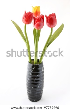 Tulips with wood production in vase