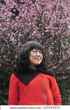 Young woman with cherry flowers.