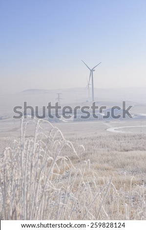 winter grassland with wind Turbines in inner mongolia china