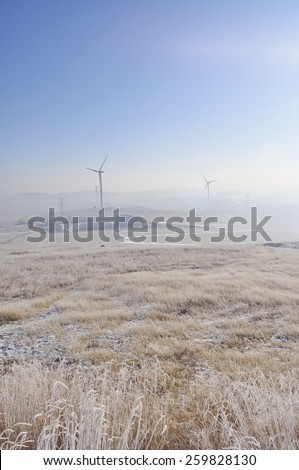 winter grassland with wind Turbines in inner mongolia china