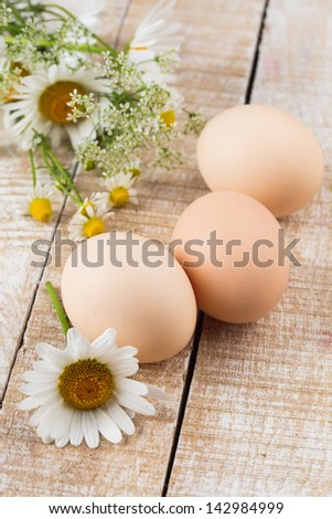Fresh organic eggs on wooden table. Selective focus. Natural/bio/organic/eco products.