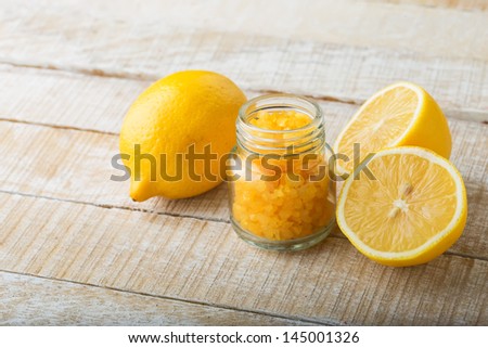 Spa product. Sea salt with lemon on wooden background. Selective focus. Natural/bio/eco/organic products.