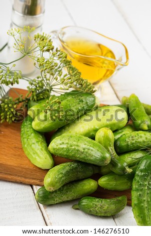 Fresh organic cucumbers  on white wooden table. Selective focus. Natural/organic/bio/healthy products.