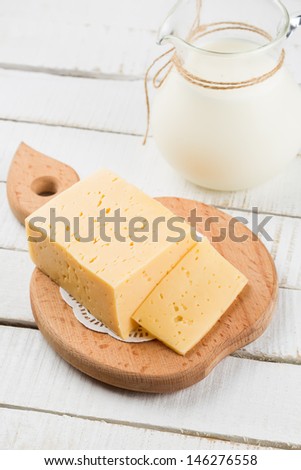 Fresh dairy products - cheese, milk. Rustic style. Bio/organic/natural ingredients. Healthy eating.