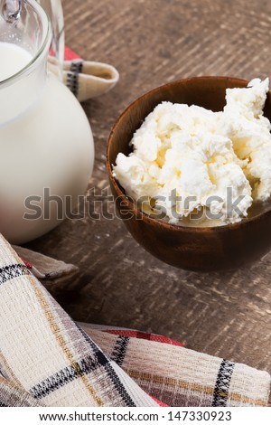 Fresh dairy products - cottage cheese, milk. Rustic style. Bio/organic/natural ingredients. Healthy eating.