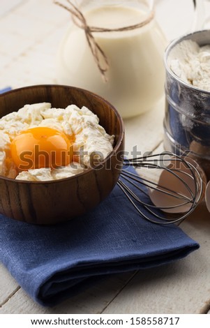 Fresh dairy products - cottage cheese, egg, milk. Rustic style. Bio/organic/natural ingredients. Healthy eating.