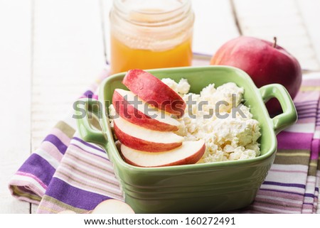 Cottage cheese, apples, honey. Rustic style. Bio/organic/natural ingredients. Healthy eating. Selective focus.
