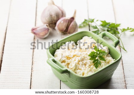 Cottage cheese, garlic, parsley. Appetizer. Rustic style. Bio/organic/natural ingredients. Healthy eating. Selective focus.