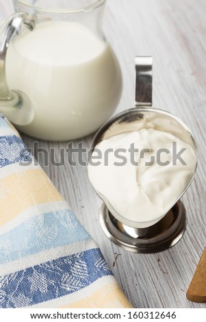 Fresh dairy products - milk, sour cream. Rustic style. Bio/organic/natural ingredients. Healthy eating.
