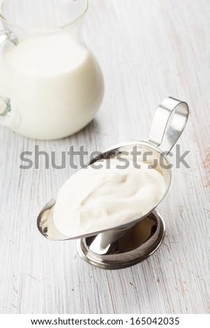 Fresh dairy products - milk, sour cream. Rustic style. Bio/organic/natural ingredients. Healthy eating.