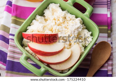 Fresh cottage cheese  in bowl with apple.  Rustic style. Bio/organic/natural ingredients. Healthy eating.