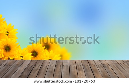 Abstract spring background for design. Flowers and wooden floor. Easter/summer background.