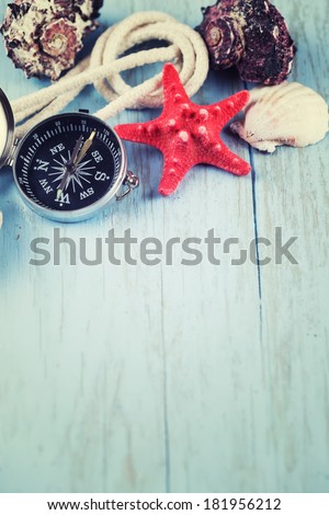 Marine items on wooden background. Sea objects on wooden table. Selective focus.
