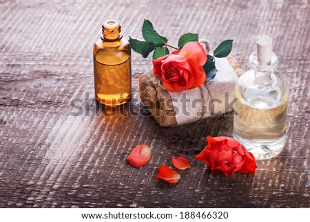 Natural handmade soap and aroma oil on wooden background. Selective focus. Rustic style.