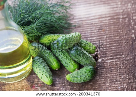 Fresh organic cucumbers on wooden table. Place for text. Selective focus. Natural/organic/bio/healthy products.