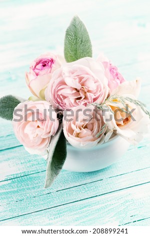 Postcard with fresh flowers on wooden background. Shabby chic. Selective focus, vertical.