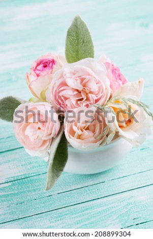 Postcard with fresh flowers on wooden background. Shabby chic. Selective focus, vertical.