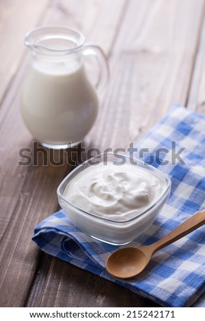 Sour cream in bowl.  Rustic style. Bio/organic/natural ingredients.
