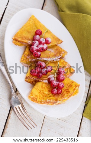 Appetizing pancakes with berries  on white table. Healthy breakfast. Selective focus.
