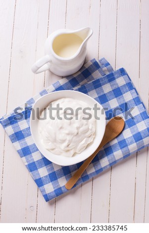 Fresh dairy products - sour cream,  milk.  Rustic style. Bio/organic/natural ingredients. Healthy eating.