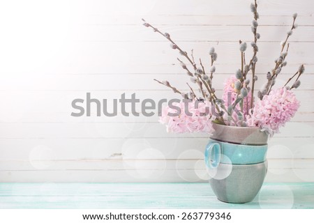 Postcard with hyacnths iand willow flowers in vase and empty place  for your text.
