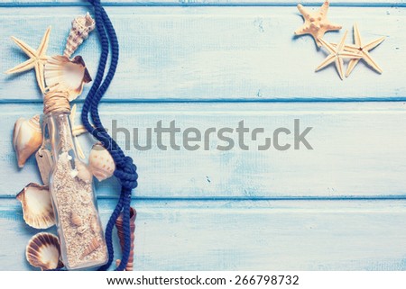 Marine items on blue painted wooden background.  Toned image. Place for text.  Selective focus.