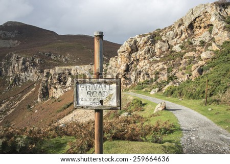A sign post and path leading up to mountains near Conwy, North Wales