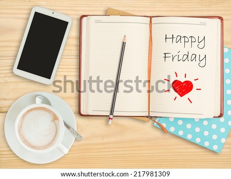 Happy Friday on notebook with pencil, smart phone and coffee cup