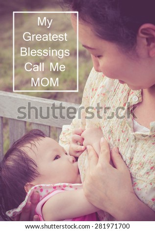 Asian mom breast feeding her baby girl in park with vintage filter with text \