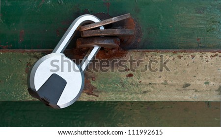 Picture of a lock on a rusted garage door