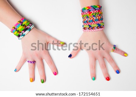 Loom bracelets on a young girl's hand Close up Young fashion concept Loom bracelets on a young girl's hand Close up Young fashion concept