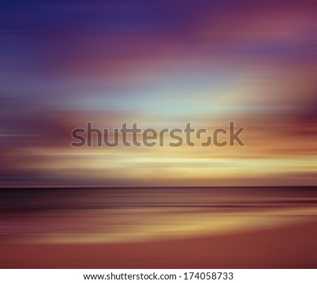Sunrise at the beach. Blurred panning motion. Abstract seascape