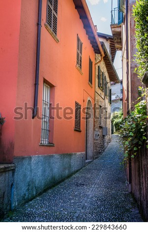 Narrow street in Varenna. Como Lake. Northern Italy. European travel, vacation, summer, destination, exploration and lifestyle concept.