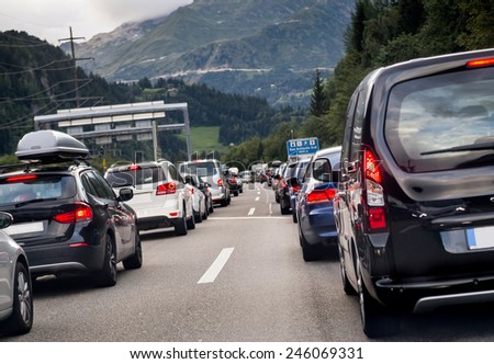 Traffic on the highway. Transportation. pollution, cars, rush hour, vacation, travel and holiday concept. Sitting in traffic on a highway in Switzerland driving home to Lucern