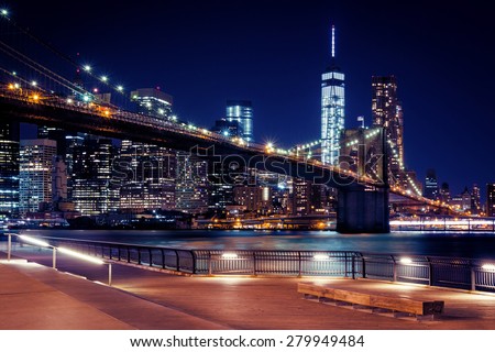 Brooklyn Bridge, Downtown Manhattan, New York. Night scene. Light trails. City lights. Urban living and transportation concept
