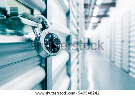 Combination lock on a self storage door. Life style, storage, moving, storing, organizing concept.