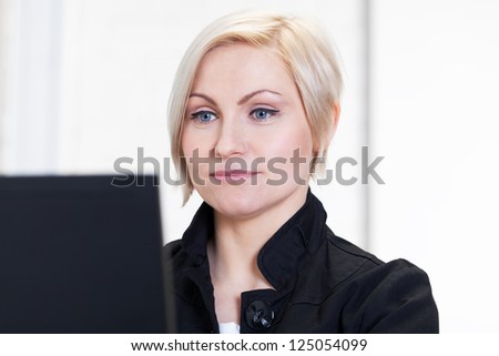 Portrait of woman working with computer