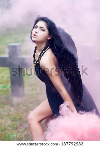 Black angel of war in the mist